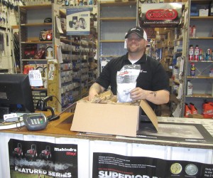 Billy Marquette, parts manager for Klem’s in Massachusetts, packs a box to fulfill an online parts order.