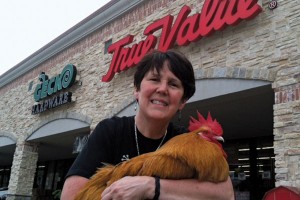 Andrea Ridout, managing partner of Gecko Hardware, uses George, the store's pet rooster and mascot, for promotional material.