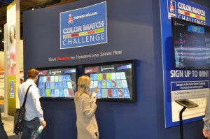 Show attendees play the touch screen game called the Color Match Challenge at the Sherwin-Williams booth. The top three fastest players won prizes each day at the show.