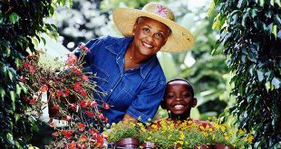 A woman and her grandson gardening