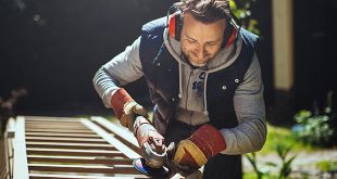 DIY smiling man grinding handrail