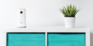 A cabinet with an air purifier on top.