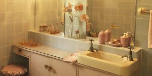 A powder room vanity bathed in golden light